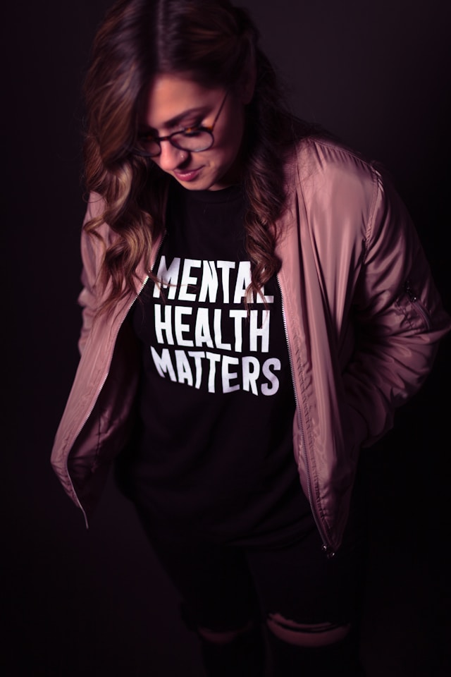 Woman wearing T-shirt with "Mental Health Matters" at the front